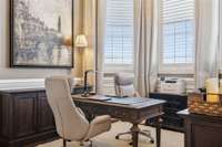 office with full height windows bathed in natural light