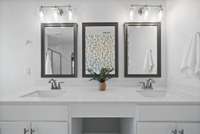 And the dual vanities! Did you catch the wallpaper on the accent wall?