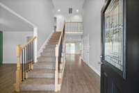 Beautiful entry open to the formal dining to the left.