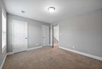 The second guest bedroom has dual closets!