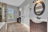 Spacious Owners' bathroom with exquisite details and private dual vanities.