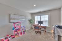 Bedroom #5 is being used as a home office/playspace