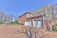 This 3 car garage has tons of room and also has a tornado shelter in the floor