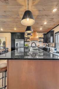 NEW KITCHEN LAYOUT!  Interior of similar cabin in community.  Interior finishes will vary from cabin to cabin.