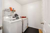Large laundry room with entry to garage