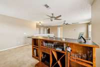 Bar is not a permanent feature, but will convey at no cost to Buyer