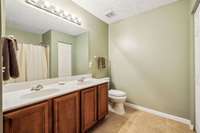 Large bathroom upstairs with double sink vanity.  This bathroom has a shower/tub combo