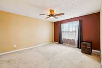 One of 3 large bedrooms upstairs.  Large closet and remote controlled light/ceiling fan