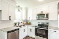 You will love the brand-new kitchen! Granite counters, stainless appliances, and tile backsplash!