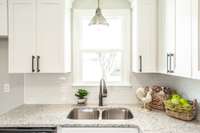 Washing dishes isn't so bad with the natural light and back yard view.