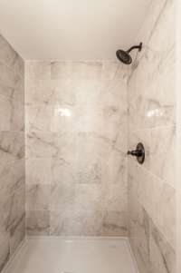This bath is also fully renovated with a tile shower.