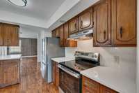 Kitchen offers great cabinet space! a pantry as well! Stainless steel appliances-
