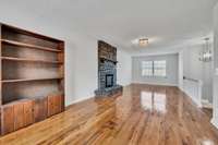 Bonus Room offers fireplace and builtin bookcases!  There is access to outside from this room- that is covered stairwell!