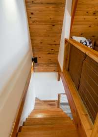 Solid wood stairs to the upstairs.