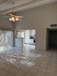 Enter into a bright open living area--ready for your personal touch--gorgeous white tile Welcomes you to your Country/City Oasis