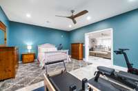 This incredibly spacious 14ft x 20ft downstairs room now functions as a hybrid guest room/home gym. This versatile space can flex to fit your lifestyle's unique needs, whether it be a music room, yoga studio, gym, craft room or another home office!