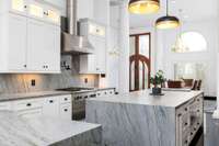 An elite high-performance Thermador range hood ensures proper air flow during culinary adventures.