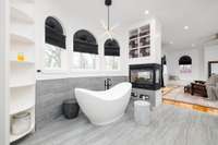 Nothing compares to the newly renovated primary bathroom, designed around the show-stopping centerpiece of a top-of-the-line matte white MTI organic soaking tub.