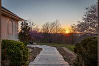 Golden hour magic, made even better by your very own hill-top view of Tennessee's breathtaking scenery. 50 tons of landscape rock surround the home, improving drainage and adding a uniquely functional element.