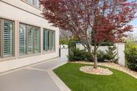 This turf area along the side of the home is a useful added feature for pet potty breaks if your family includes a dog or two.