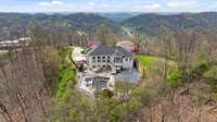 A scene out of a storybook, lush rolling hills surround this home as far as the eye can see. Beloved Owl Hill Nature Sanctuary, full of peaceful trails and wildlife, is a 6 minute drive away.