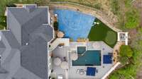 The vibrant blue sports court includes a 3 point and free throw line, ideal for friendly games of 3 on 3 basketball.