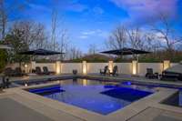 Meticulously maintained, the remodeled pool boasts updated coping and stylish surround accents. Expansive lounge areas invite you to sunbathe, unwind, and fully embrace your private backyard retreat.