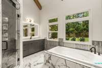 The bathroom features double vanities with custom cabinets, walk-in shower, and separate water closet.