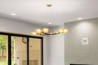 This contemporary chandelier with branch-like armature and soft amber lighting create a beautiful focal point.
