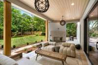 A contemporary fireplace anchors this inviting space, with floating hearth and smooth concrete surround.
