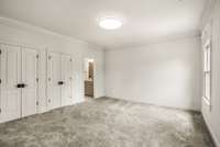 The largest bedroom upstairs features an ensuite bathroom and oversized closet.