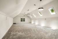 The massive bonus room features a custom wet bar with beverage fridge, and an abundance of natural light from the skylights, creating an incredible, flexible space. There are so many possibilities.