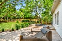 Brand new hardscape, fence, landscaping, and hot tub all create an incredible oasis.