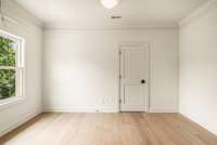 This bedroom would make a perfect office or yoga room.