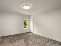 All secondary bedrooms have clean finishes, large windows, and quality flooring.