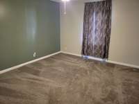 The 2 bedrooms are upstairs.  Both are are 13' x 14' and have carpeting.