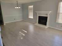Spacious living room with fireplace.
