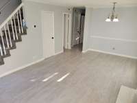 View of living room showing the stairway leading to the 2nd floor