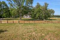 The 4-board fencing just sets off this amazing property.