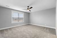 Another oversized bedroom upstairs with attached bathroom.