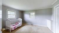 Primary bedroom features a walk in and reach in closet.  Also features two built-in dressers.