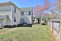 Rear of the home is lined by a privacy fence and has stepping stone paths from front to rear yard.