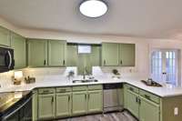 New hardware, fresh paint, updated light fixtures. Arched pull down faucet, double bowl sink.