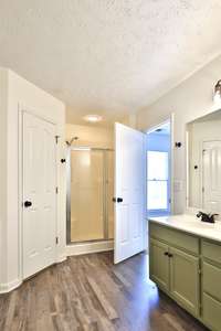 Separate shower with nice shower head/fixture.