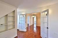 View from living room toward breakfast eat in area. French doors.