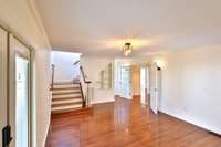 Living room with view toward rear stairs.