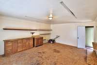 This workshop is being sold as is, but has potential for creating your dream come true space: writer's retreat, musician or artist space, crafting, home school/play space, home business, or storage space. Door in back leads to separate storage area.