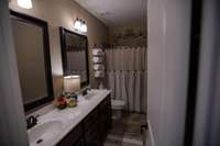 Guest bath located on the same side of the home as the zoned guest bedrooms.