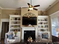 Soring Ceilings and beautiful built-in book cases .