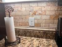 Upgraded stone backsplash.  Look at the details in this kitchen.
